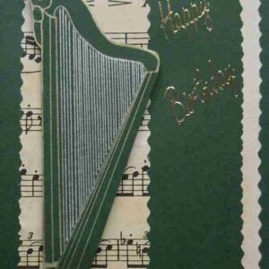 Harp1 is a green card with a harp on top of music paper