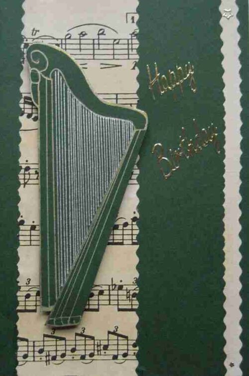 Harp1 is a green card with a harp on top of music paper