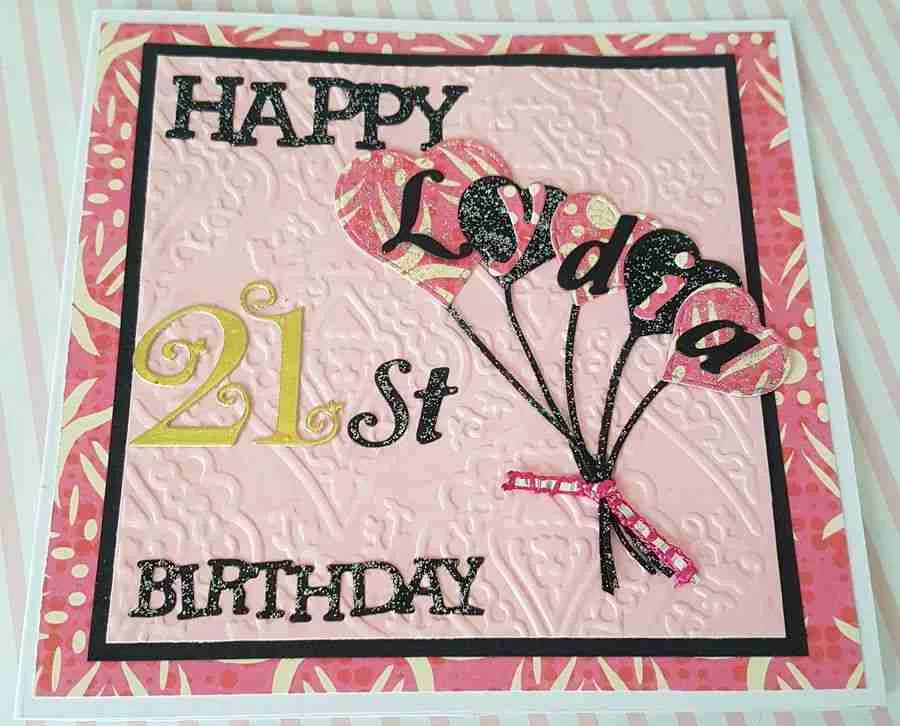 21st card Handmade with pink and black design, featuring embossed background and personalized name on floating balloons. Customizable in different colours.
