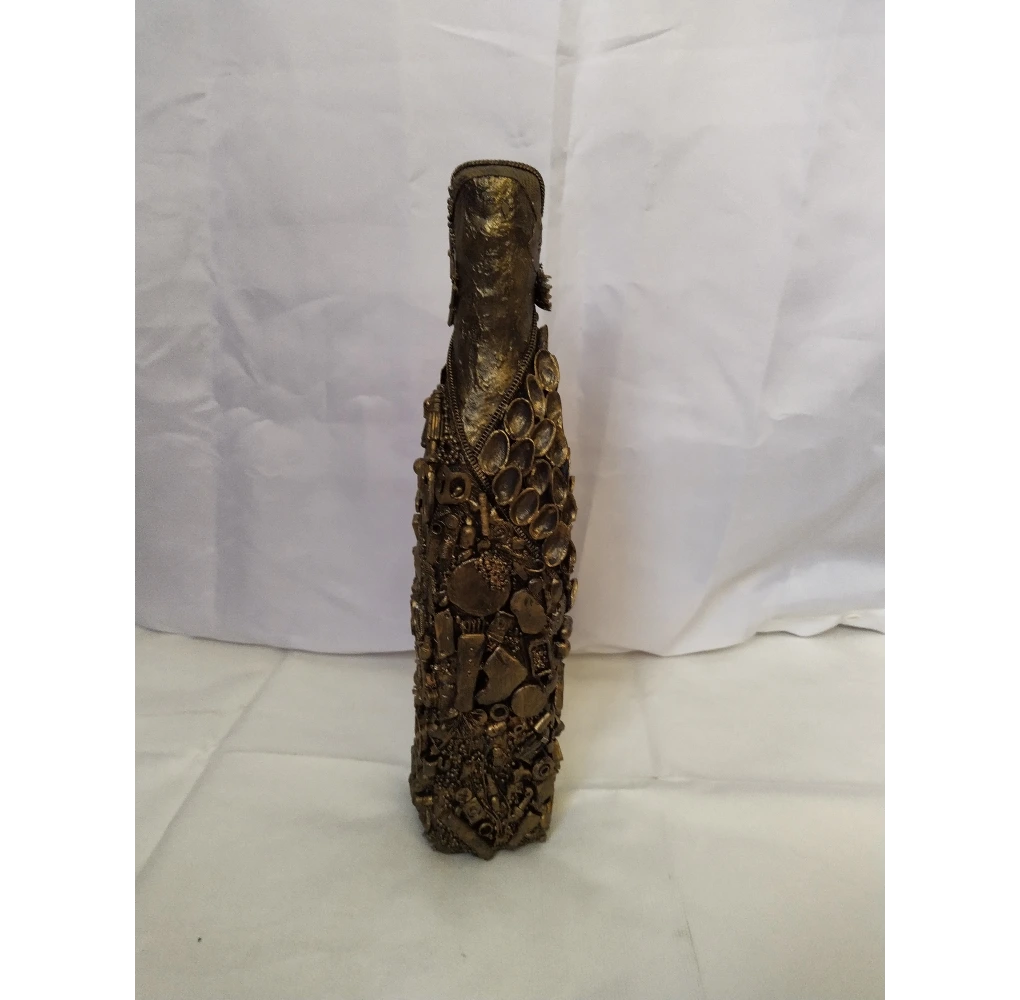Bronze Bottle, Covered in recycled mixed media, all with a golden bronze finish.