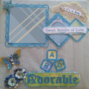 Baby Boy 'Precious Moments' Front page of the album with 3D flowers, butterflies, and the words 'adorable,' 'sweet bundle of love,' and 'it's a boy