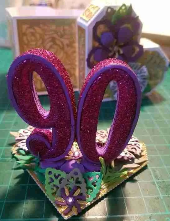 90th Bday Card-1 Luxurious 3D birthday card with die-cut flowers and leaves, embellished with faux gems, and a matching heart-shaped ornate box.