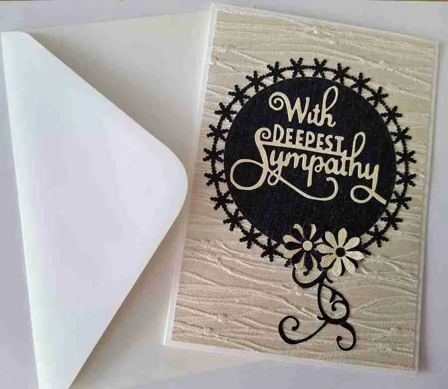 Sympathy Card-5 Handmade sympathy card with beige textured paper, featuring a black circle with the words "With Deepest Sympathy" and two black and beige floral accents at the bottom right.