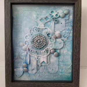 Rhythms of Creation-1 A mixed media artwork featuring textured layers in soft baby blues, incorporating recycled materials like wood, paper, and plastic, creating a visually dynamic and harmonious composition that symbolizes transformation and renewal.