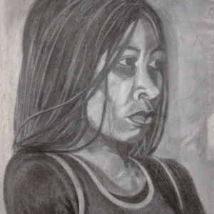 Solemn Look-1 is a charcoal drawing of a young black lady sitting on a chair, the chair cannot be seen in the picture.