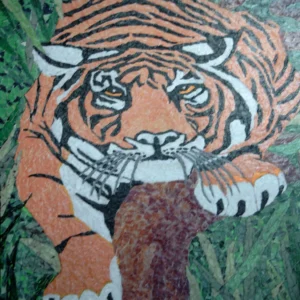 Tiger-1 tiny pieces of orange, white, green, black and brown create a picture of a tiger