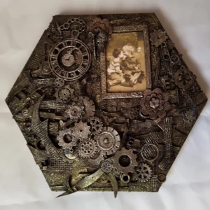 A Moment in Time-1Mixed media artwork featuring a sepia photograph of a young boy leaning in to kiss a giggling girl, beside a small clock frozen at 9:05 p.m., surrounded by textured layers of paper, cogs, and found objects evoking themes of memory and time.