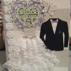 Wedding #2, A photo album in amethyst and peridot, with a lace heart, rhinestone-adorned dress, and 'Mr & Mrs' on the cover.