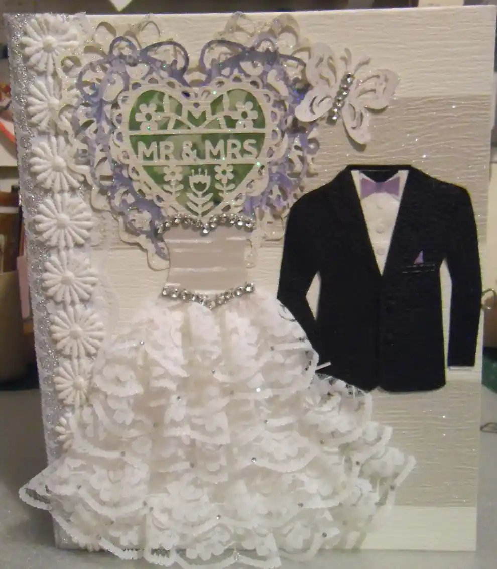 Wedding #2, A photo album in amethyst and peridot, with a lace heart, rhinestone-adorned dress, and 'Mr & Mrs' on the cover.