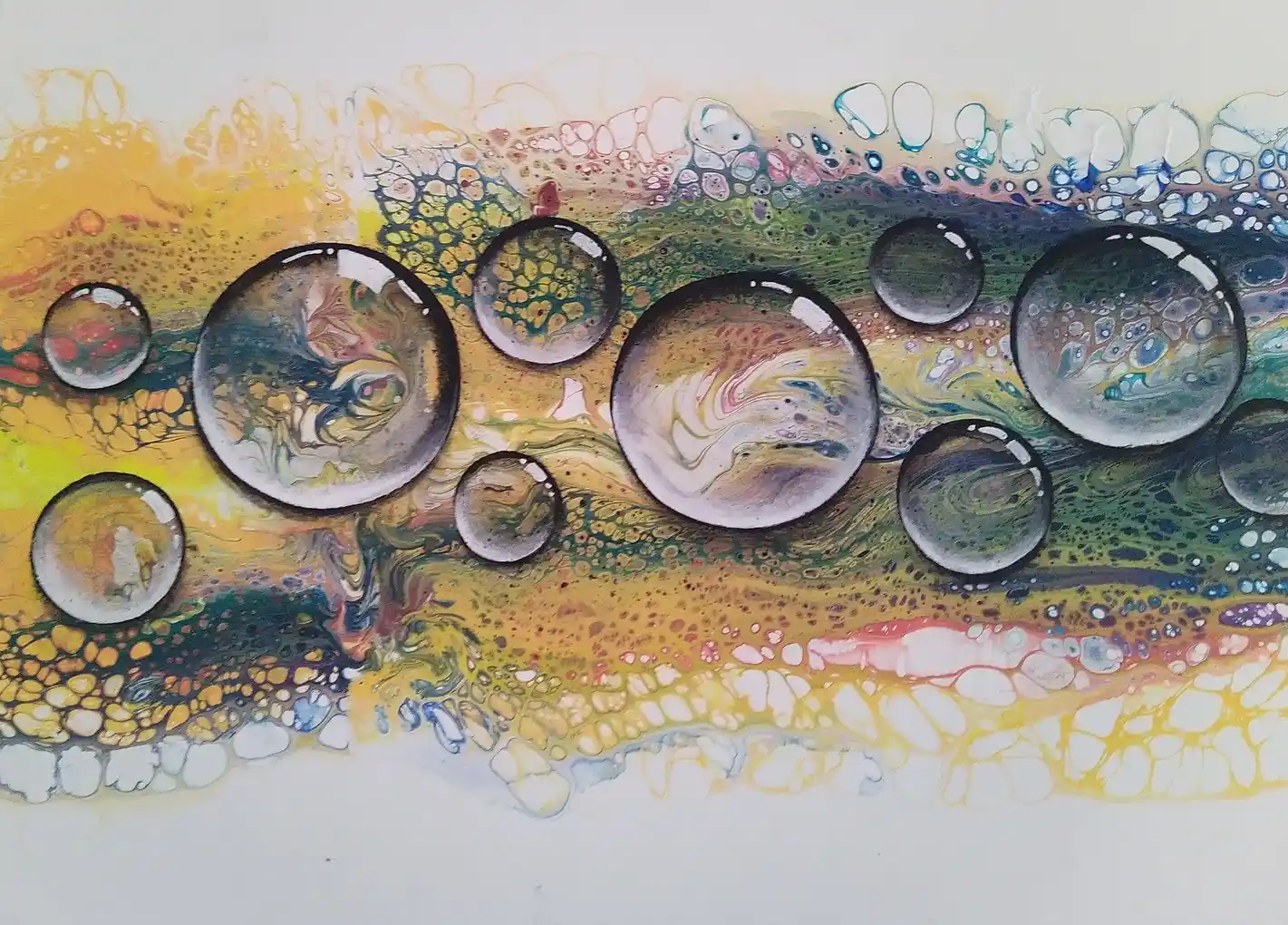 10 Breaths of Motion an acrylic pour with ten glass-like orbs floating over a marbled, multicoloured background.