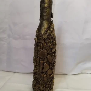 Bronze Bottle, Covered in recycled mixed media, all with a golden bronze finish.