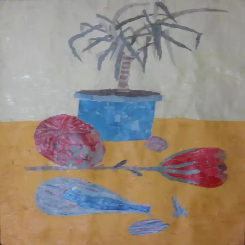 Collage artwork made from tiny torn pieces of paper, showing a blue plant pot with long grey leaves above a bottle and fruit shapes on a warm yellow surface.