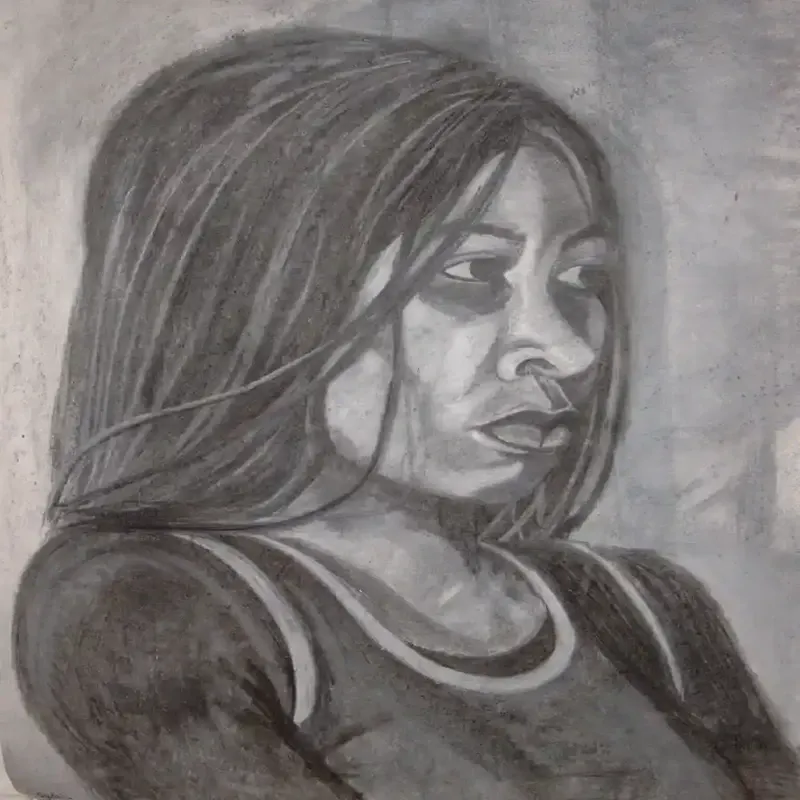 Charcoal portrait of a woman in profile, her long hair falling forward as soft shading highlights her eye, nose, and lips against a textured background.