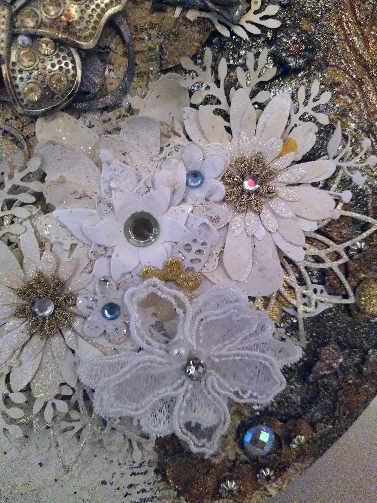 The Gentle Flutter, close up of mixed‑media artwork featuring a metallic butterfly, lace textures, and soft florals