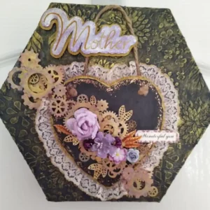 Hexagonal canvas with a slate heart, gold‑edged lace, purple flowers, cardboard cogs, and a “Wonderful you” tag.