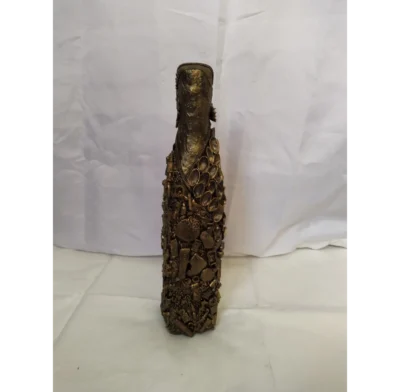 Bronze Bottle Bronze Bottle, Covered in recycled mixed media, all with a golden bronze finish.