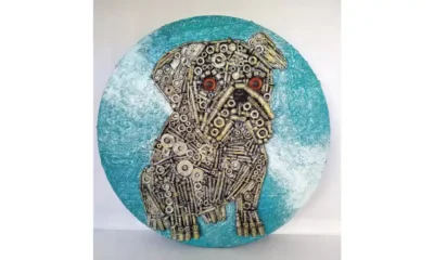 Faithful Guardian-Pug Faithful Guardian-Pug, a mixed-media portrait of a pug with a soft blue circular background, showing the dog's gentle, loyal expression and textured features.