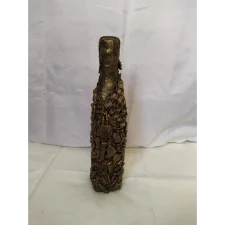 Bronze Bottle-1, Covered in recycled mixed media, all with a golden bronze finish.