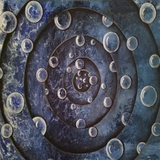 Blue Vortex #3 A swirling dance of delicate bubbles, gently spiralling toward a central pull. The soft, flowing motion of colours and layers creates a sense of movement and mystery.